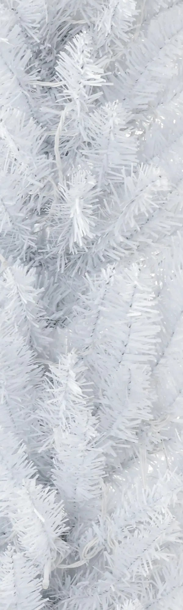 Tall white pencil tree with warm lights