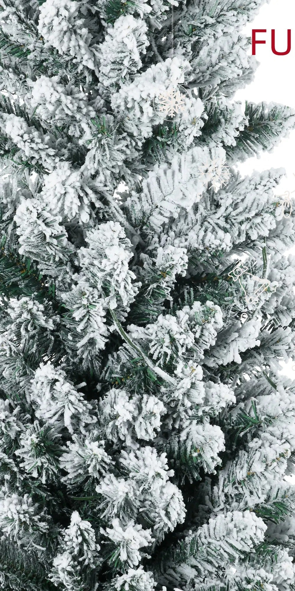 Snowy flocked pencil tree with warm lights