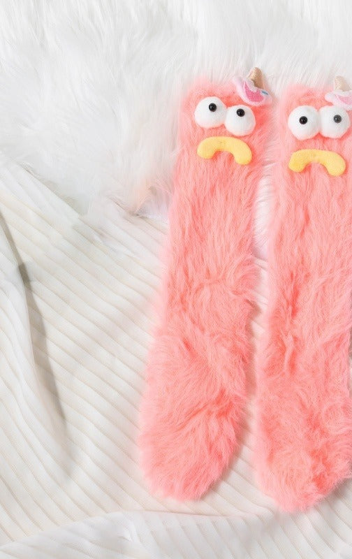 Fluffy pink monster socks with funny face