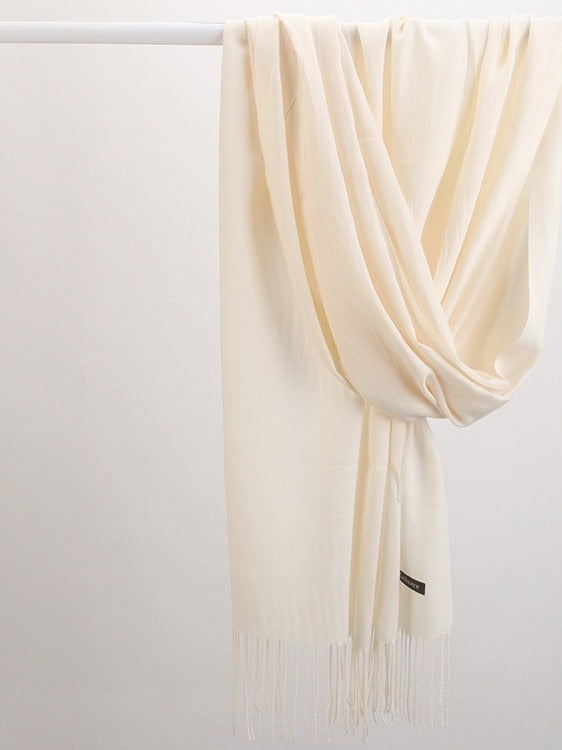 Woman in soft fringed scarf