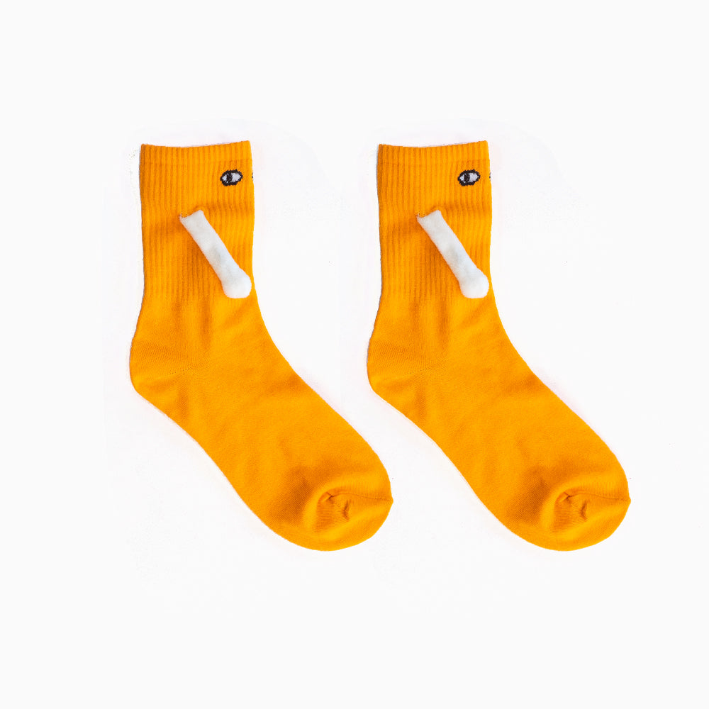 Two socks with magnetic hands holding each other