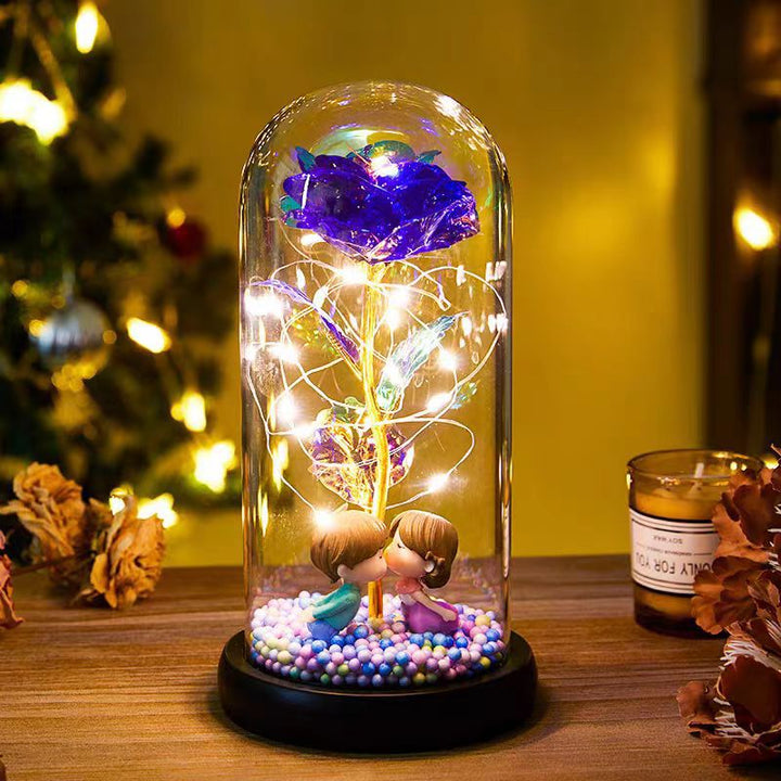 Red rose in glass dome with lights