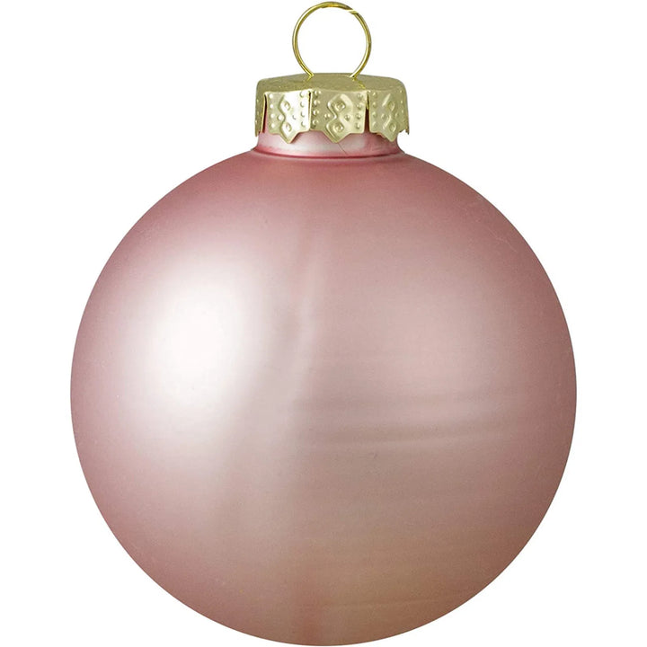 Nine pink glass Christmas baubles with gold caps