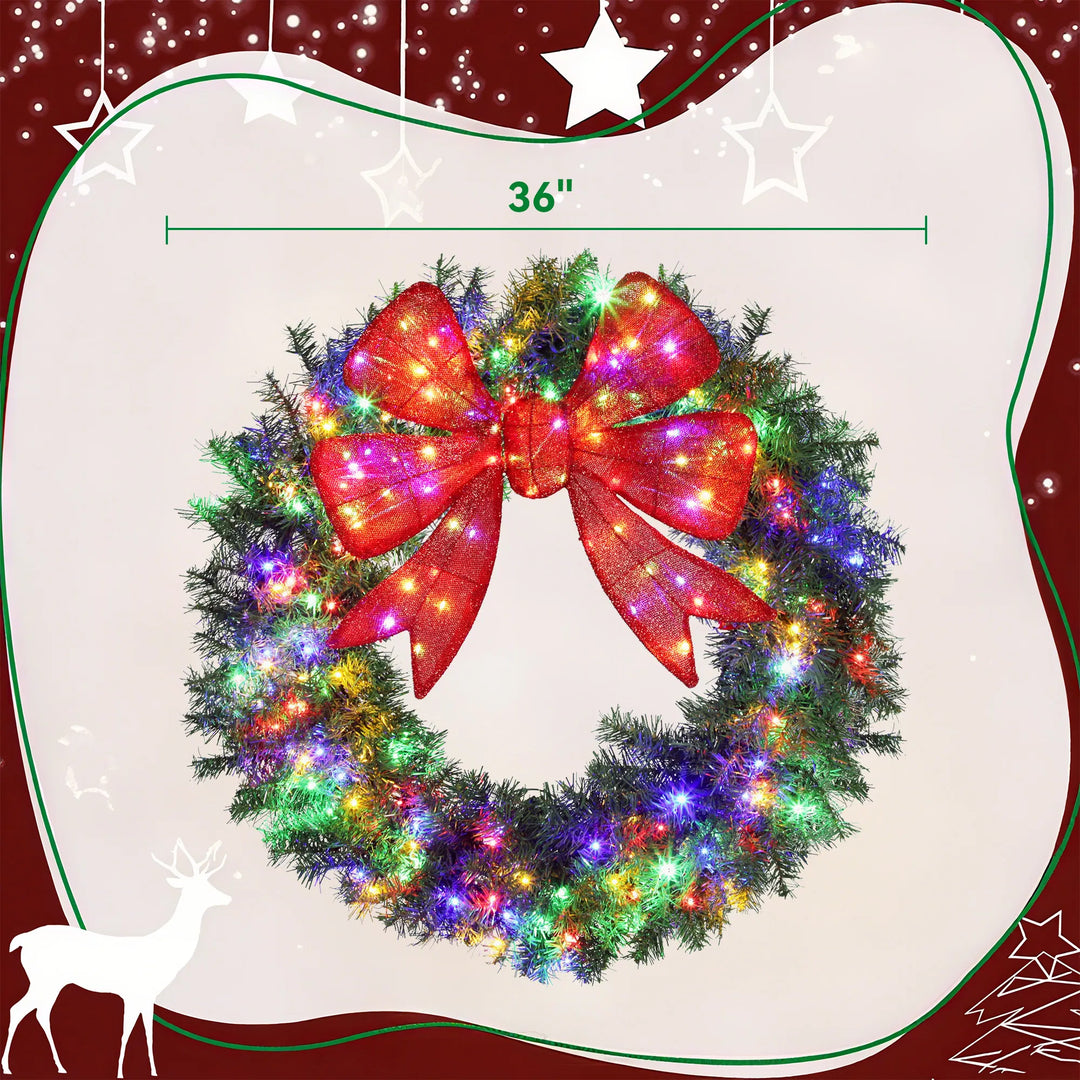 Large lit Christmas wreath with red bow
