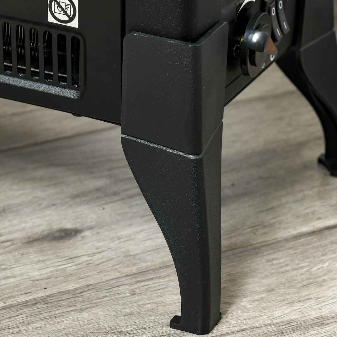 black electric stove heater with open glass front flames