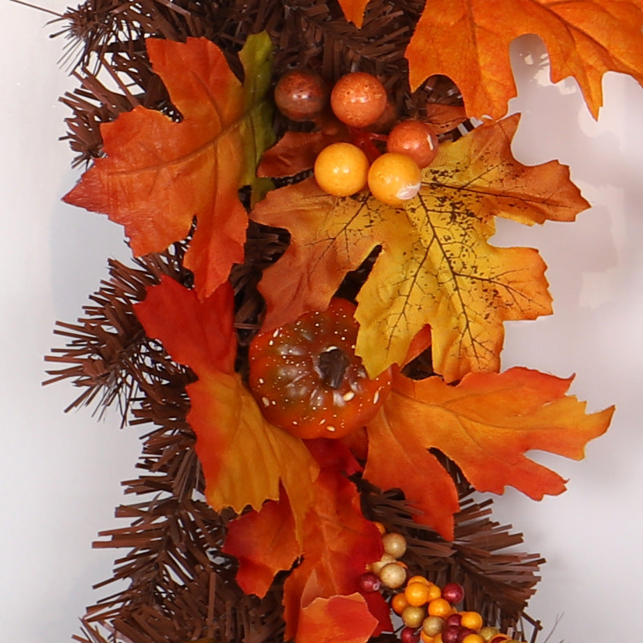 Autumn maple leaf garland on a mantel