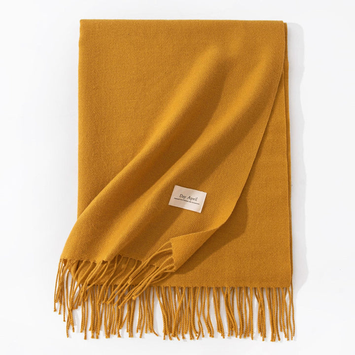 Woman wearing wide soft shawl scarf