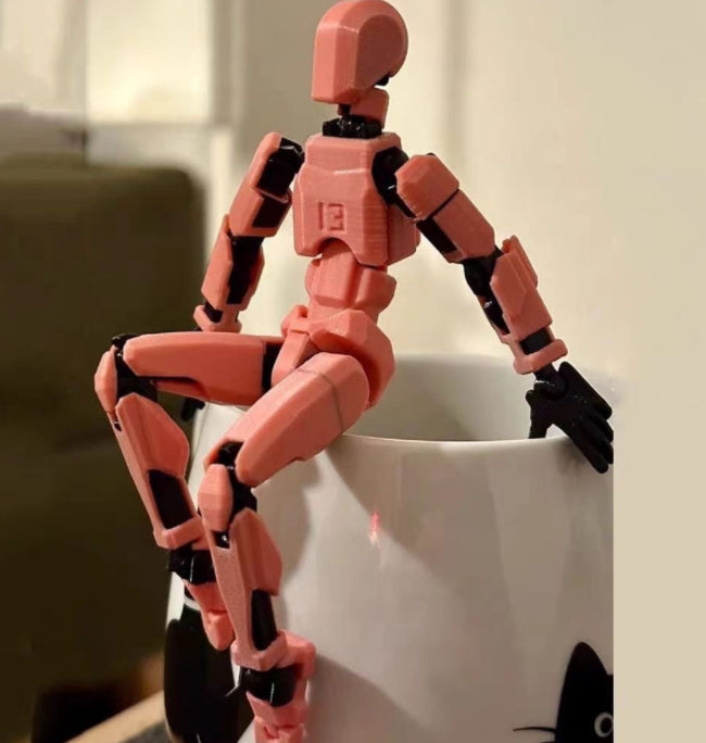 Poseable 3D printed robot figure on desk