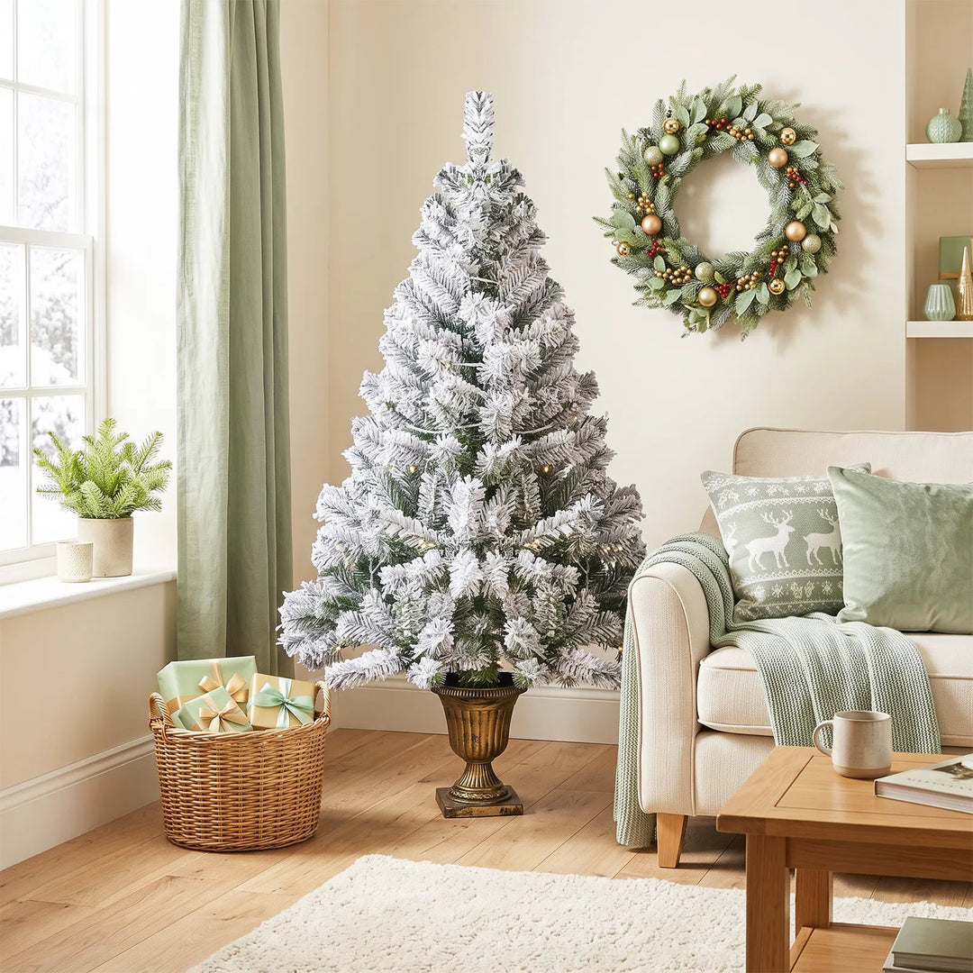 Small flocked tree in a decorative pot