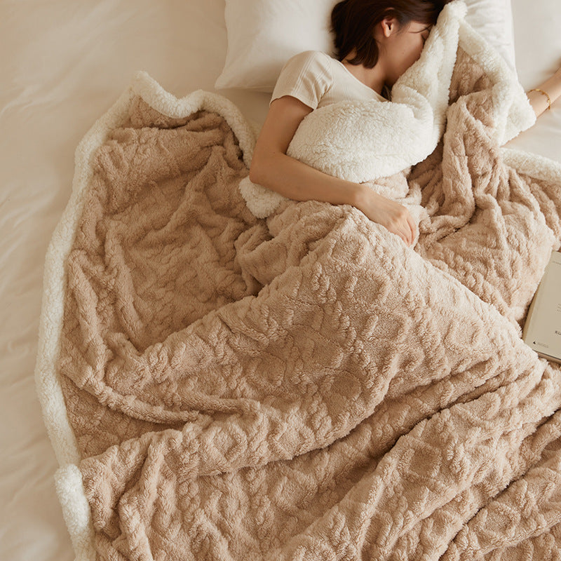 Tufted fleece throw draped over sofa