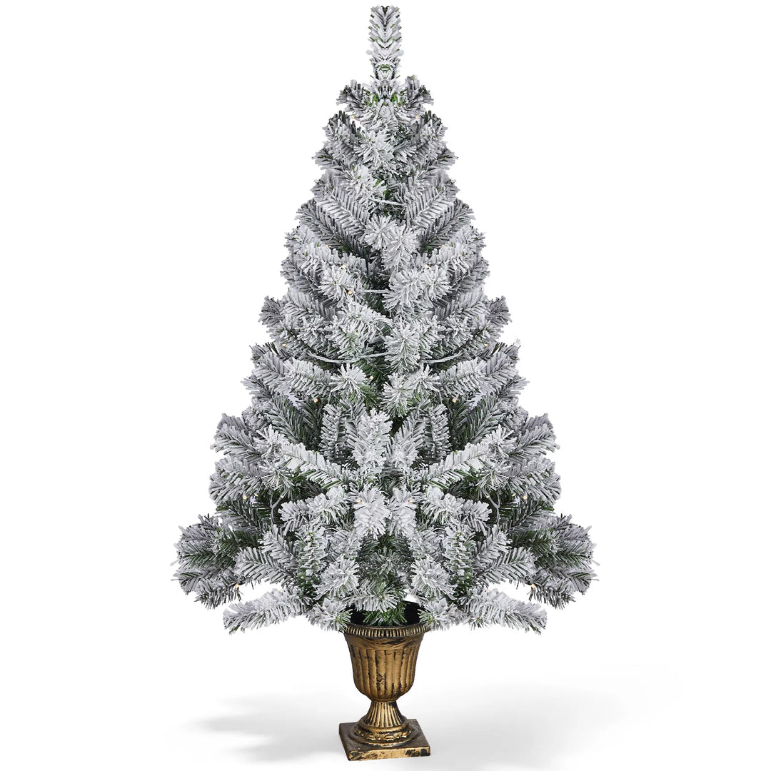 Small flocked tree in a decorative pot