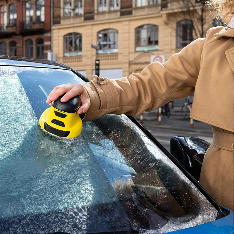 Electric ice scraper on frosty windscreen