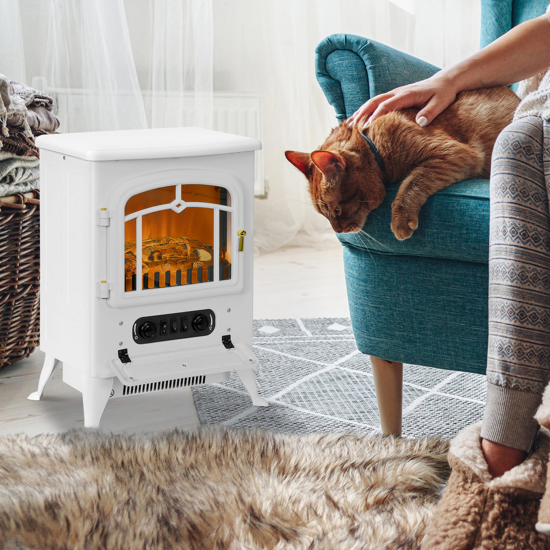 white electric stove heater with glass door and log flames