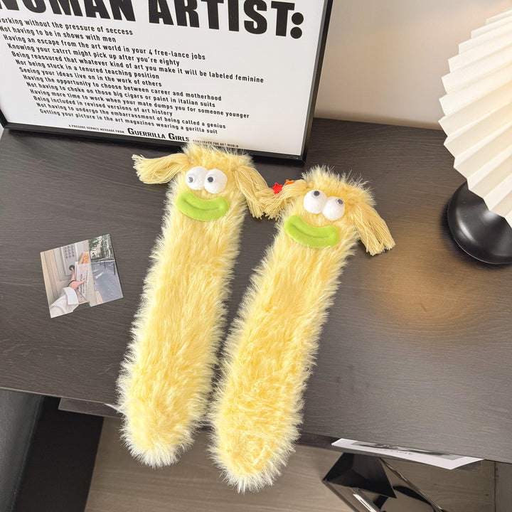 Fluffy socks with googly-eyed monster faces