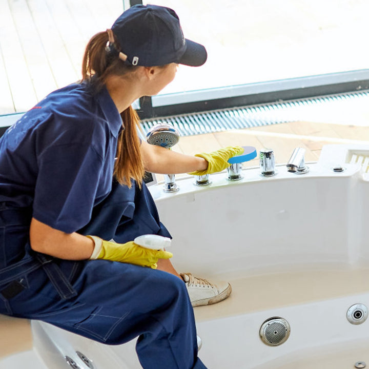 Cordless electric spin scrubber with brush heads