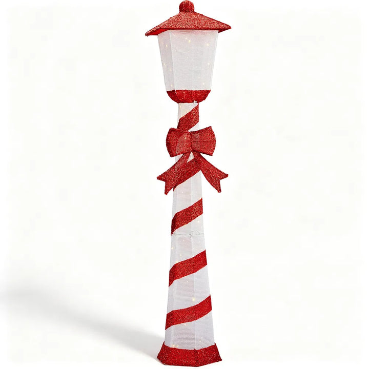 Candy cane striped Christmas lamp post glowing