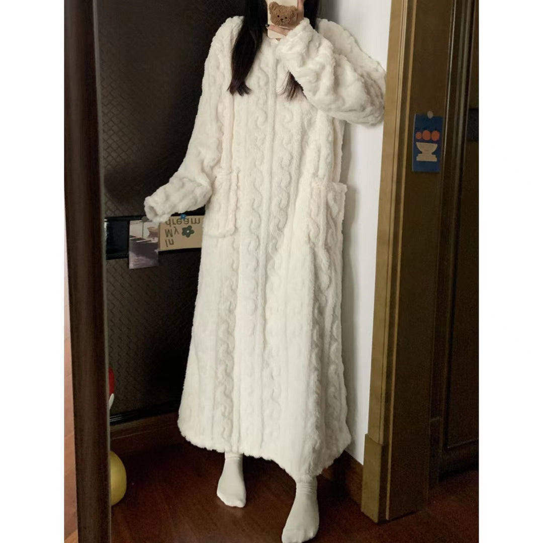 Woman in long pink coral fleece nightgown