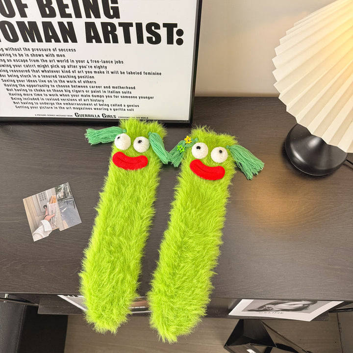 Fluffy socks with googly-eyed monster faces