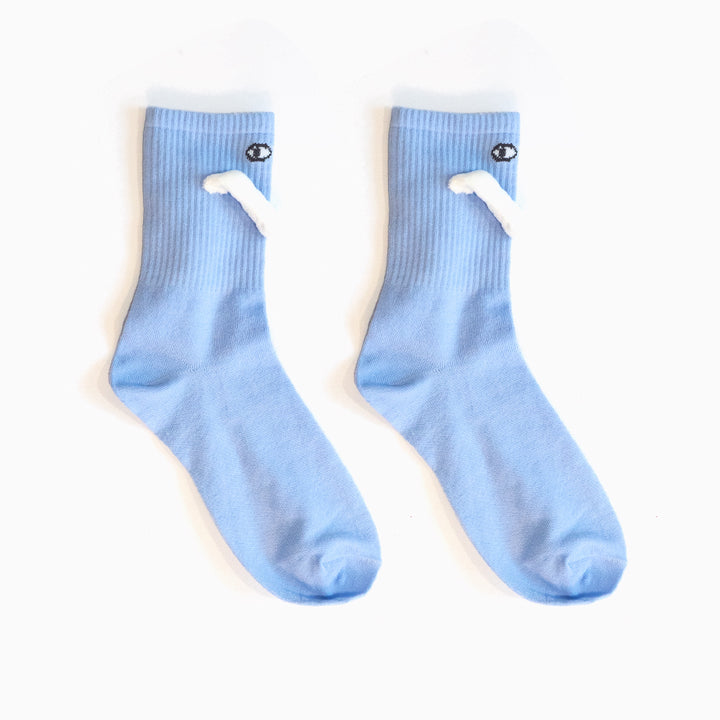 Two socks with magnetic hands holding each other