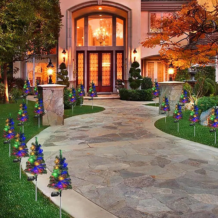 Solar Christmas tree stake lights in garden
